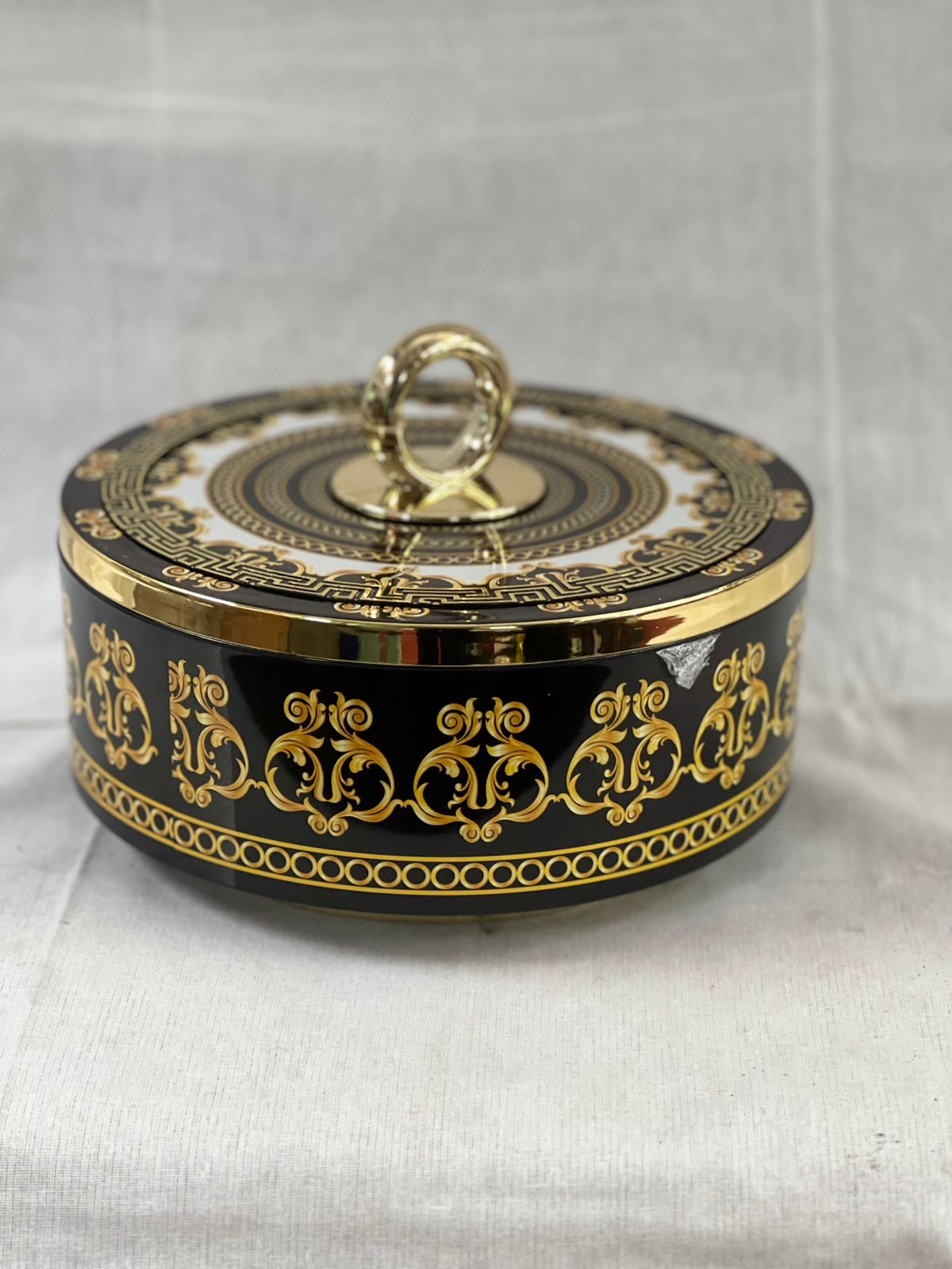 Elegant Black & Gold Round Decorative Box with Ornate Detailing
